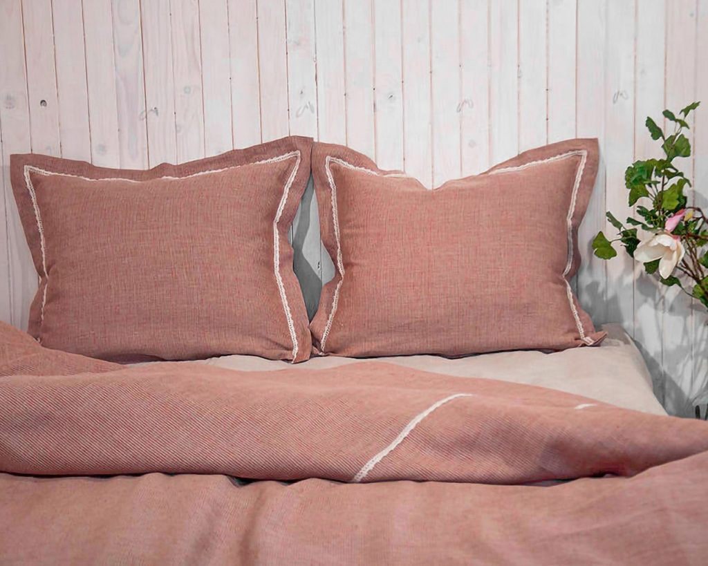bed with two pillows and a duvet