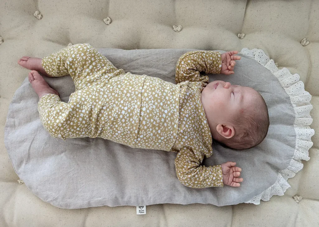 baby sleeping on a wool mattress