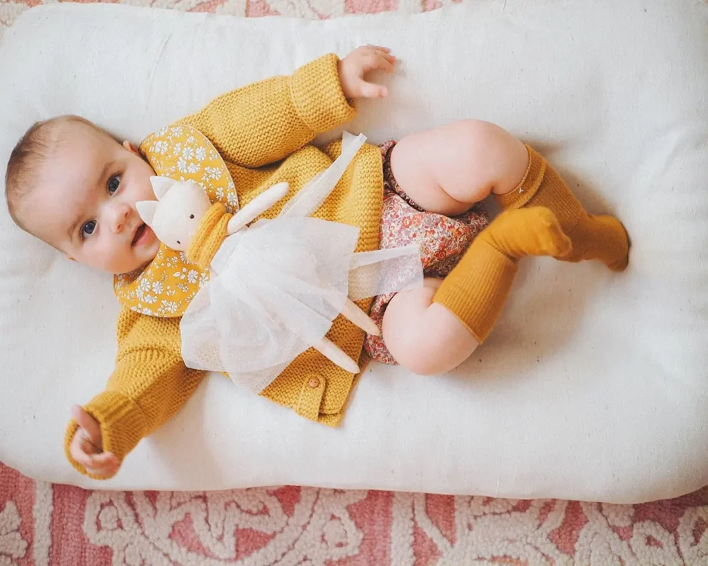 baby sleeping on a wool baby mattress