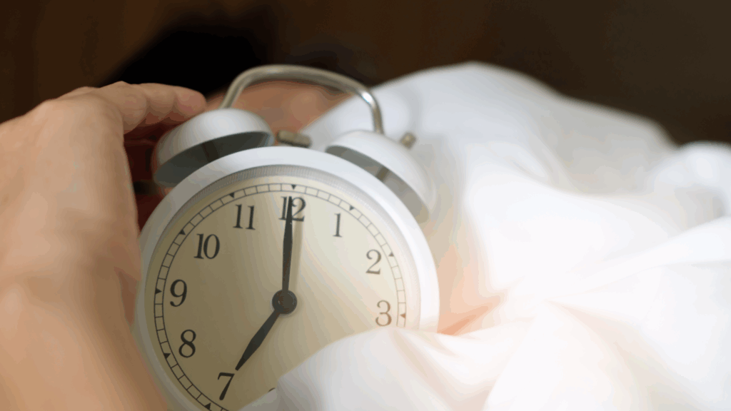 clock on a bed sheet