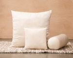 different shapes of wool pillows with wool filling on a zero waste rug